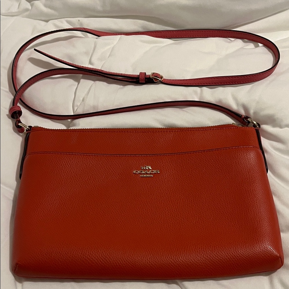 Coach Orange Pebbled Leather Crossbody Bag with Pink Strap